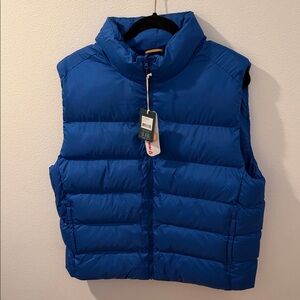 tentree navy blue vest with orange logo accents